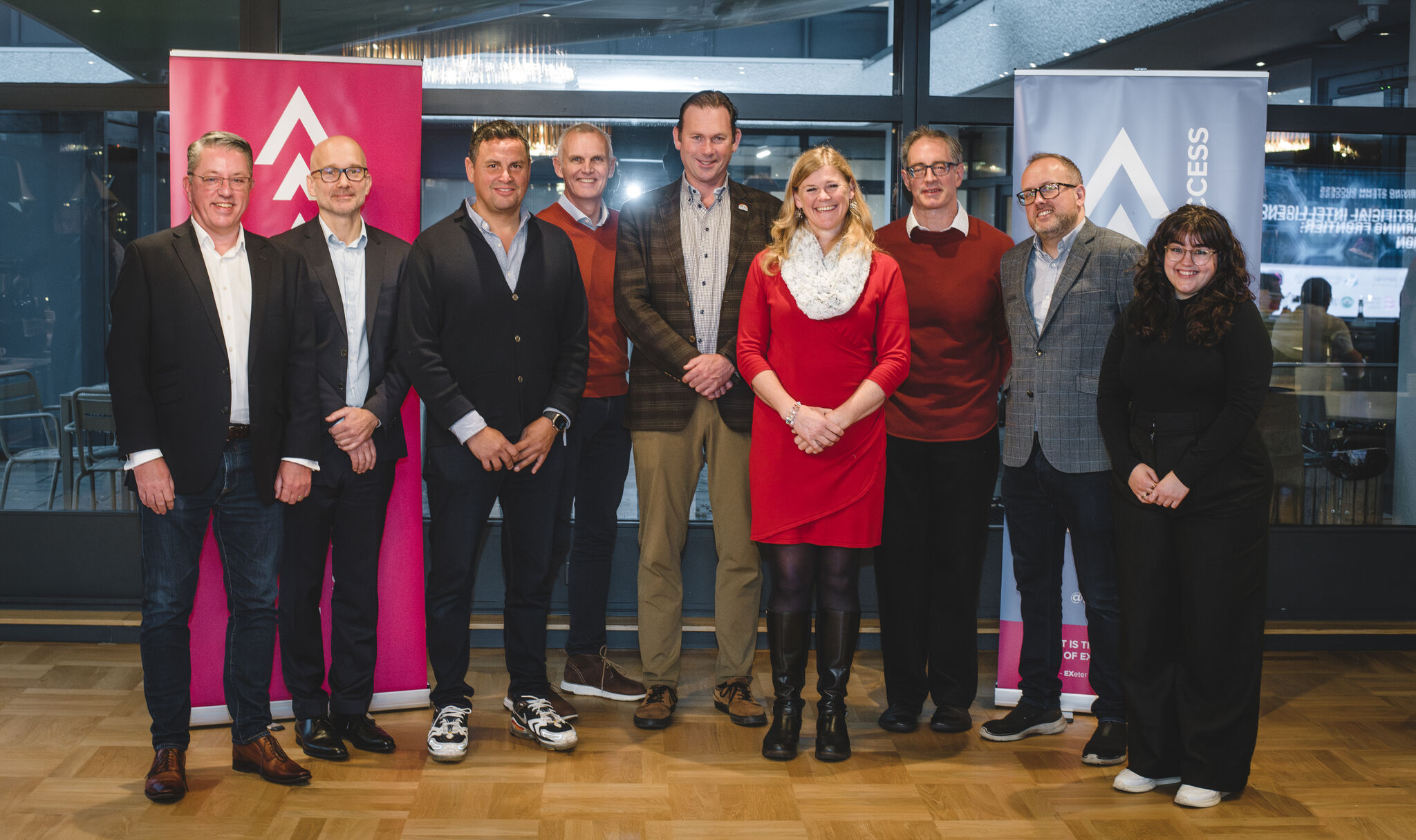 A group of speakers for an event posing.